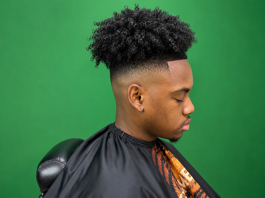 Curly high top with a smooth fade, side view